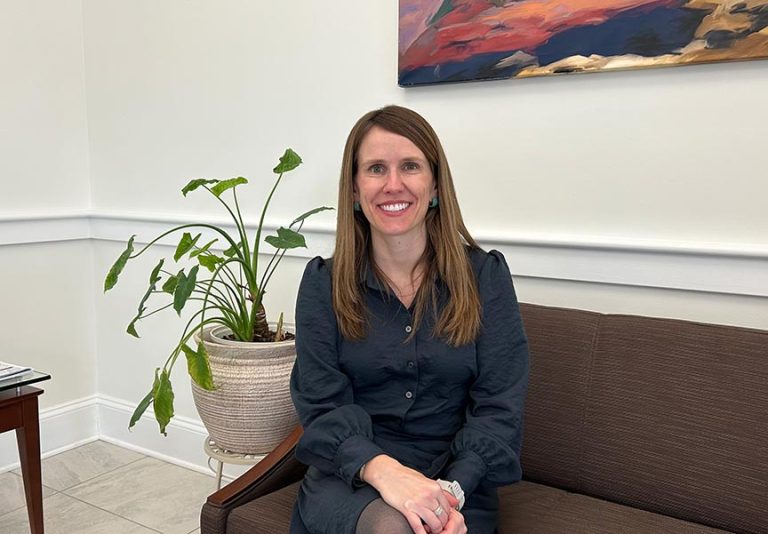 Commercial Lender Gloria Williams sitting on bench