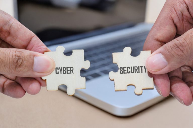 Hands,Holding,Two,Wooden,Jigsaw,Puzzle,Pieces,Labeled,Cyber,Security