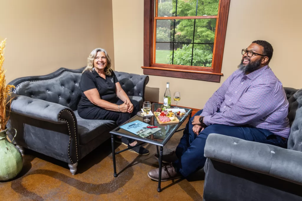 Kevin Hill seated with business partner