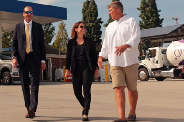 business officers talking and walking with a client